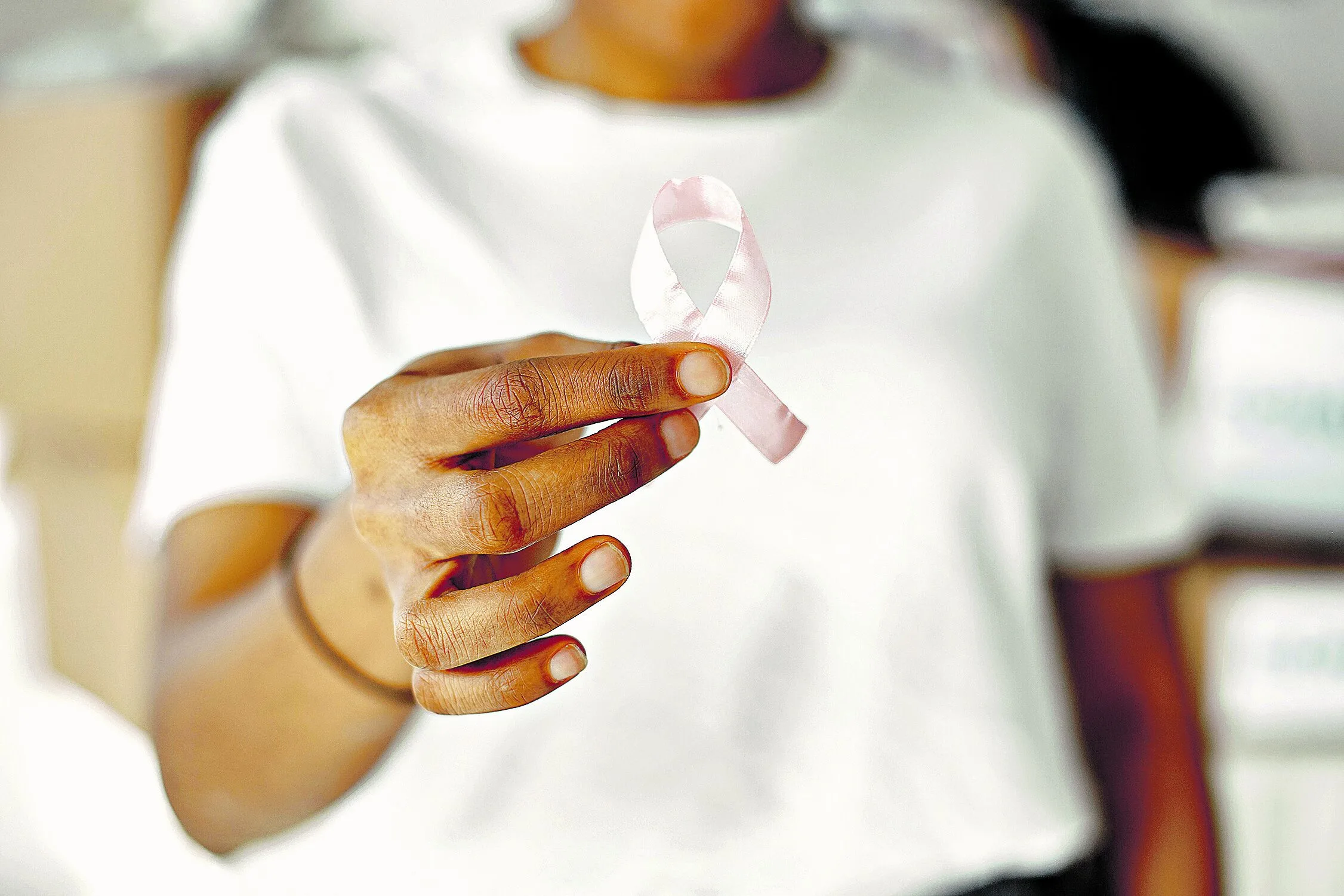 White t-shirt. Fight against AIDS. Sign with ribbon.