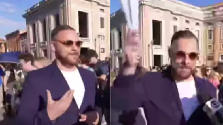 Durante a cobertura da GloboNews, a repórter entrevistava fiéis e turistas quando encontrou Luís, um brasileiro empolgado com o momento e bem equipado: ele segurava dois leques