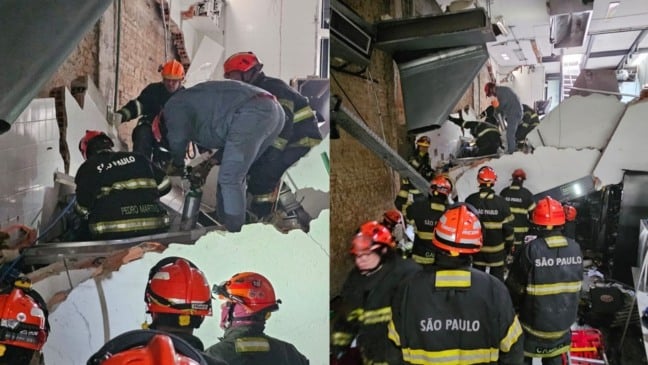 Bombeiros trabalham no resgate de vítimas que ainda estão sob os escombros.