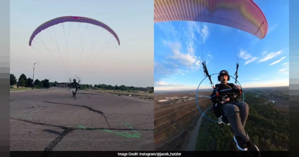 Homem vai trabalhar de parapente motorizado para escapar do trânsito